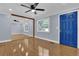 Living room features hardwood floors, natural light, and a striking blue front door at 5942 Morgan Rd, Atlanta, GA 30340