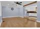 Bright, open living room with hardwood floors, ceiling fan, and a view to the kitchen at 5942 Morgan Rd, Atlanta, GA 30340