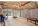 Spacious unfinished basement with concrete flooring, ready for customization, and featuring a ladder for home projects at 5945 Boulder Bluff Dr, Cumming, GA 30040