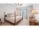Bedroom featuring a four poster bed, and a side table with decorative lamp at 5945 Boulder Bluff Dr, Cumming, GA 30040