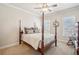 Bedroom with a four poster bed, ceiling fan, and dual windows allowing ample natural light at 5945 Boulder Bluff Dr, Cumming, GA 30040