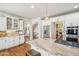 Bright kitchen with white cabinets, granite countertops, a large island with seating and stainless steel appliances at 5945 Boulder Bluff Dr, Cumming, GA 30040