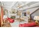 Bright living room with fireplace, built-in shelving, and hardwood floors under a beautiful coffered ceiling at 5945 Boulder Bluff Dr, Cumming, GA 30040