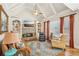 Cozy living room with a stone fireplace, built-in shelves, and a ceiling fan at 5945 Boulder Bluff Dr, Cumming, GA 30040