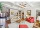 Inviting living room with coffered ceiling, hardwood floors, and a view of the staircase and doorway at 5945 Boulder Bluff Dr, Cumming, GA 30040