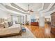 Spacious primary bedroom with tray ceilings and hardwood floors at 5945 Boulder Bluff Dr, Cumming, GA 30040