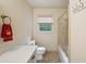 Bathroom featuring a tub/shower combination, vanity and patterned flooring at 8540 Ridge Rd, Fairburn, GA 30213