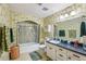 Cozy bathroom features a shower-tub combo, single sink vanity, and vintage wallpaper at 8540 Ridge Rd, Fairburn, GA 30213