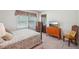 Bedroom with natural light, patterned bedding, and wood furnishings at 8540 Ridge Rd, Fairburn, GA 30213