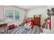 Well-lit bedroom with hardwood floors offers a comfortable retreat and relaxing space at 8540 Ridge Rd, Fairburn, GA 30213