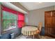 Bright breakfast nook with a window view and seating for two, perfect for morning coffee at 8540 Ridge Rd, Fairburn, GA 30213
