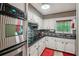 Contemporary kitchen equipped with sleek countertops, a stainless steel oven, and stylish cabinetry at 8540 Ridge Rd, Fairburn, GA 30213