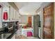Stylish kitchen with black granite counters and stainless-steel refrigerator at 8540 Ridge Rd, Fairburn, GA 30213