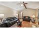 Spacious living room with hardwood floors, neutral walls, comfortable sofas and decor lamps at 8540 Ridge Rd, Fairburn, GA 30213