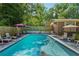 Backyard in-ground pool with lounge chairs, perfect for summer relaxation and entertainment at 8540 Ridge Rd, Fairburn, GA 30213
