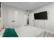 The bedroom includes a large screen television and an ensuite bathroom at 2965 Pharr Court South Nw # 304, Atlanta, GA 30305