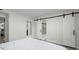 A bright bedroom features modern sliding doors to the bathroom and closet at 2965 Pharr Court South Nw # 304, Atlanta, GA 30305
