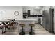 Well-lit open concept kitchen features stainless steel appliances and island seating with room for dining at 2965 Pharr Court South Nw # 304, Atlanta, GA 30305