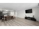Spacious living room area with wood look flooring provides ample space to relax and enjoy time at home at 2965 Pharr Court South Nw # 304, Atlanta, GA 30305