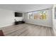 Open living room area with large window for natural light and wood look flooring at 2965 Pharr Court South Nw # 304, Atlanta, GA 30305