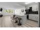 Bright, open-concept living space with natural light and a modern kitchen featuring stainless steel appliances at 2965 Pharr Court South Nw # 304, Atlanta, GA 30305
