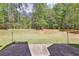 Expansive backyard featuring a large lawn and mature trees, perfect for outdoor activities at 3070 Glad Dale Se Dr, Conyers, GA 30094