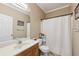 Bathroom features a white vanity, a shower with curtain, and updated fixtures at 3070 Glad Dale Se Dr, Conyers, GA 30094