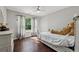 Comfortable bedroom with wood floors, natural light, and a ceiling fan at 3070 Glad Dale Se Dr, Conyers, GA 30094