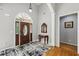 Elegant foyer with hardwood floors, high ceilings, and a decorative front door with sidelights at 3070 Glad Dale Se Dr, Conyers, GA 30094