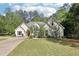 Charming home with well-maintained landscaping, mature trees, and a spacious driveway at 3070 Glad Dale Se Dr, Conyers, GA 30094