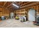 Spacious garage featuring exposed beams, shelving units, and ample storage space at 3070 Glad Dale Se Dr, Conyers, GA 30094