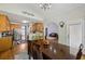 Bright kitchen with stainless appliances, wooden cabinets, leading to a dining area at 3070 Glad Dale Se Dr, Conyers, GA 30094