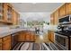 Kitchen with stainless steel appliances, light wood cabinets, and an eat-in breakfast area at 3070 Glad Dale Se Dr, Conyers, GA 30094