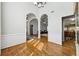 Spacious living area showcases arched entryways, hardwood floors, and elegant architectural details at 3070 Glad Dale Se Dr, Conyers, GA 30094