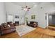 Spacious living room featuring vaulted ceilings and gleaming hardwood floors at 3070 Glad Dale Se Dr, Conyers, GA 30094