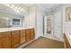 Bright main bathroom features a double vanity, tiled floor, and separate tub and shower at 3070 Glad Dale Se Dr, Conyers, GA 30094