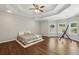 Bright main bedroom with tray ceiling offers natural light and hardwood floors at 3070 Glad Dale Se Dr, Conyers, GA 30094