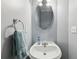 Cozy powder room with stylish fixtures and a decorative mirror at 3070 Glad Dale Se Dr, Conyers, GA 30094