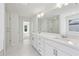 Modern bathroom boasting double sinks, quartz countertop, and a large, frameless glass shower at 5816 Creek Indian Dr, Sugar Hill, GA 30518