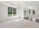 Elegant dining room featuring large windows and a modern chandelier, perfect for entertaining at 5816 Creek Indian Dr, Sugar Hill, GA 30518