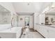 Bright bathroom boasts a soaking tub, walk-in shower, and dual vanity at 110 White Oak Trl, Cumming, GA 30028