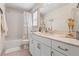 Bathroom featuring a white vanity with a marble countertop and a bathtub with shower at 110 White Oak Trl, Cumming, GA 30028