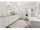 Modern bathroom features a soaking tub, walk-in shower, and dual vanity at 110 White Oak Trl, Cumming, GA 30028