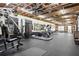 Bright gym featuring exposed wood ceiling, ample equipment, large mirrors and a separate entry at 110 White Oak Trl, Cumming, GA 30028
