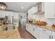 Well-appointed kitchen with granite counters, stainless steel appliances, and white cabinets at 110 White Oak Trl, Cumming, GA 30028