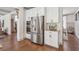 Bright kitchen with granite counters, stainless appliances, and views to adjacent spaces at 110 White Oak Trl, Cumming, GA 30028