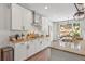 Spacious kitchen with an island, stainless steel appliances, and breakfast nook at 110 White Oak Trl, Cumming, GA 30028