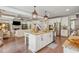 Open kitchen with island seating, seamlessly connects to the living area, great for gatherings at 110 White Oak Trl, Cumming, GA 30028