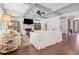 Bright living room with coffered ceilings, a fireplace, and hardwood floors at 110 White Oak Trl, Cumming, GA 30028
