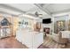 Cozy living room featuring a fireplace, coffered ceilings, and plenty of natural light at 110 White Oak Trl, Cumming, GA 30028